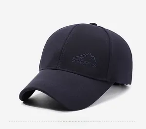 Detail view of navy blue outdoor baseball cap featuring high-quality mountain embroidery