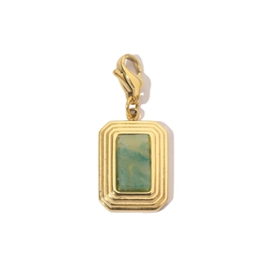 Macro view of green natural stone pendant with gold lobster clasp for necklaces