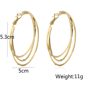 Detail view of 18K gold plated layered hoop earrings with 5.3cm x 5cm dimensions and 11g weight