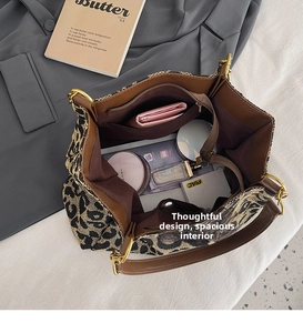 Interior view of leopard print tote bag showing spacious capacity and inner zipper pocket