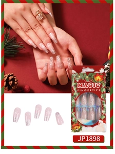 Detailed view of silver glitter gradient and white snowflake patterns on press-on nails