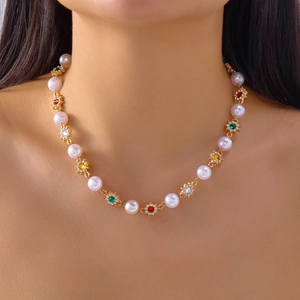 Hip hop pearl and metal necklace with colorful rhinestone flower accents on model