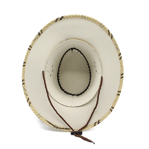 Detail view of woven straw cowboy hat interior with sweatband and adjustable wind rope