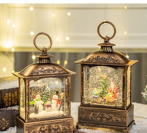 Close-up of vintage bronze Christmas lanterns with snowmen and Santa Claus scenes