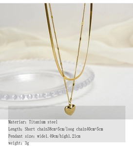 Macro shot of double-layer titanium heart pendant necklace with Love You engraving
