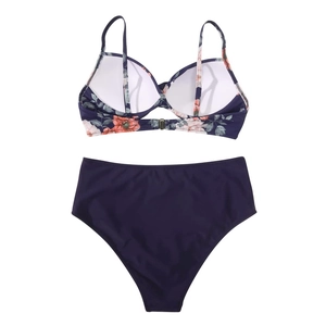 Detail of floral bikini top with navy high waist bottoms showing strap and buckle