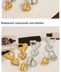 Macro detail of waterproof gold and silver heart earrings on a stylish stone tray