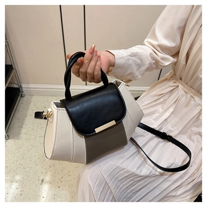 Chic tricolor contrast PU leather crossbody bag held by a model to show size and fit