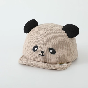 Detailed view of beige corduroy baby cap with cute panda embroidery and 3D ears