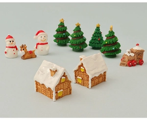 Detailed set of Christmas miniature figurines including snowmen, reindeer and ginger houses