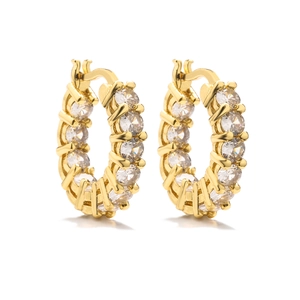 Detailed close-up of 18K gold hoop earrings with micro-pave cubic zirconia settings