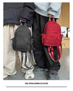 Stylish solid color nylon casual backpack for men and women, waterproof daily daypack.
