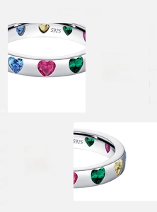 Macro detail of S925 sterling silver ring featuring colorful heart-shaped cubic zirconia