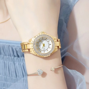 Elegant gold tone women's watch with rhinestone dial and matching heart bracelet set