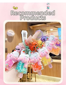 Close-up of bunny ice cream keychains featuring colorful beads, glitter, and bells