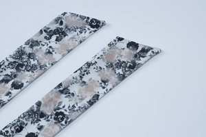 Close-up of black and white rose floral print fabric with high-quality stitched edges