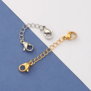 Gold and silver stainless steel extender chains with dual lobster clasps on a split background