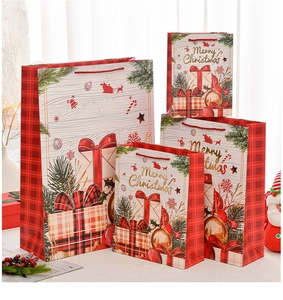 Various sizes of Christmas gift bags with red plaid borders and golden Merry Christmas text