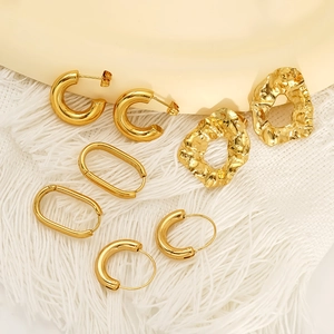 Set of four minimalist gold-tone irregular geometric stud and hoop earrings for women