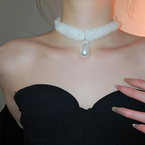 Close-up of elegant white plush choker featuring a large pearlescent waterdrop pendant