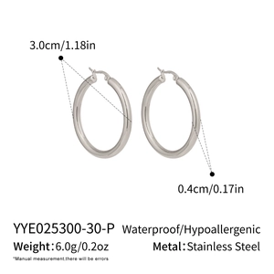 Detail of silver stainless steel hoop earrings showing 30mm diameter and waterproof texture