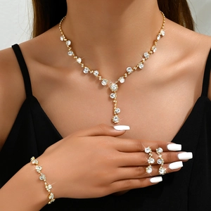 Sparkling gold jewelry set with rhinestone necklace bracelet and earrings for formal events