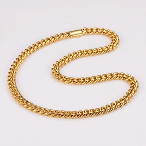 Close-up of golden Cuban link chain details with a secure lobster clasp mechanism