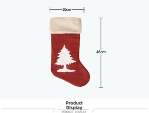Detail of red knit Christmas stocking with white tree pattern, size 20cm x 46cm