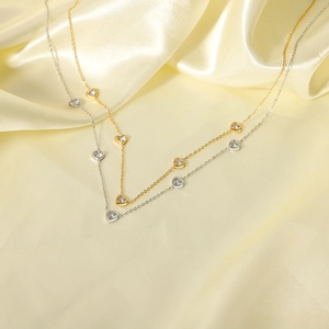 Gold and silver stainless steel necklaces with zircon heart pendants on silk