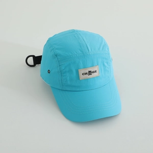 Detailed view of the sky blue quick-dry camper cap with a CHANGE logo woven patch