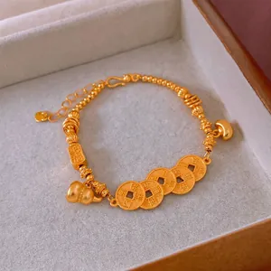 Ancient gold-plated beaded bracelet with Chinese coin and gourd charms on velvet padding