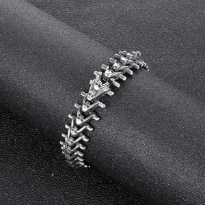 Detailed close-up of a vintage spine-shaped stainless steel skeleton link bracelet