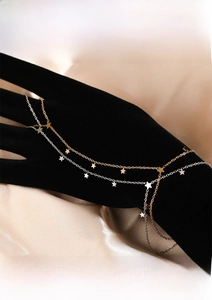 Detailed close-up of minimalist stainless steel star charm chain with PVD plating