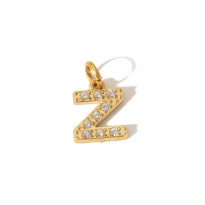 Macro detail of PVD gold plated stainless steel letter Z pendant with cubic zirconia