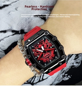 Macro detail of tonneau sport watch with red silicone strap and plated bezel textures