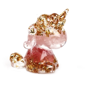 Crystal unicorn desk ornament with pink quartz and gold foil flakes in clear resin