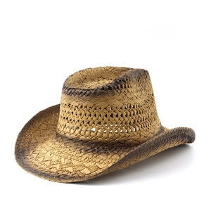 Detail of hollow-woven straw cowboy hat featuring brown gradient edges and breathable crown