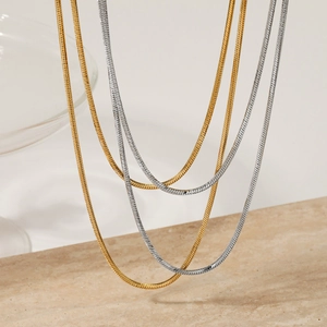 Double layered minimalist snake chain necklaces in gold and silver polished stainless steel