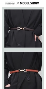 Detail of slim leather belts in dark brown and caramel on a black blazer for styling