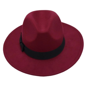 Close-up of wine red wool felt fedora featuring a wide brim and black ribbon bow detail