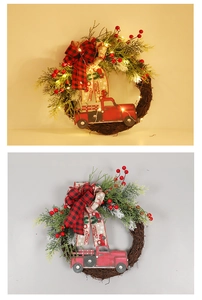 Detail of Christmas truck wreath with PE pine needles, red berries and warm LED lights