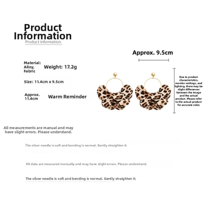 Detail view of layered leopard print hoop earrings with alloy and fabric dimensions