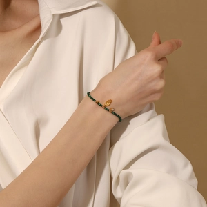 Hamsa Hand green malachite beaded bracelet with 18K gold plated stainless steel details