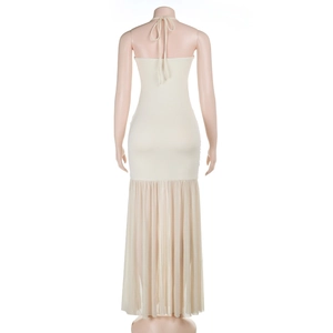 Detailed back view of beige maxi dress with mesh stitching and delicate beadwork decoration