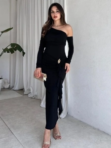 Elegant black one-shoulder maxi dress with long sleeve and gold metal buckle detail