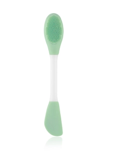 Detailed macro view of mint green double-sided silicone face brush and mask applicator