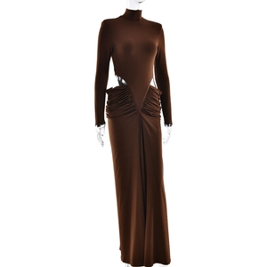 Detail view of brown long sleeve maxi dress with waist cut-outs and ruched hip texture