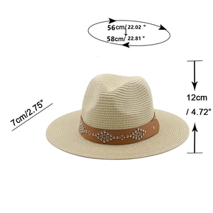 Classic straw Panama hat in beige with brown leather band and silver studs for sun protection