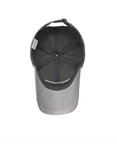 Detail view of cotton baseball cap interior showing stitching, label and metal buckle