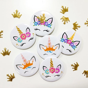 Set of six cute unicorn birthday badges with floral wreaths and golden crowns
